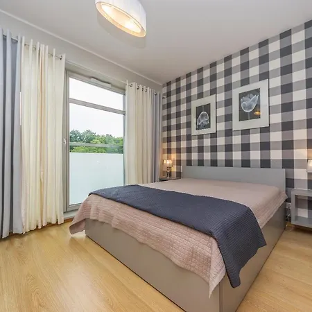 Lägenhet Glow Apartments, Marina